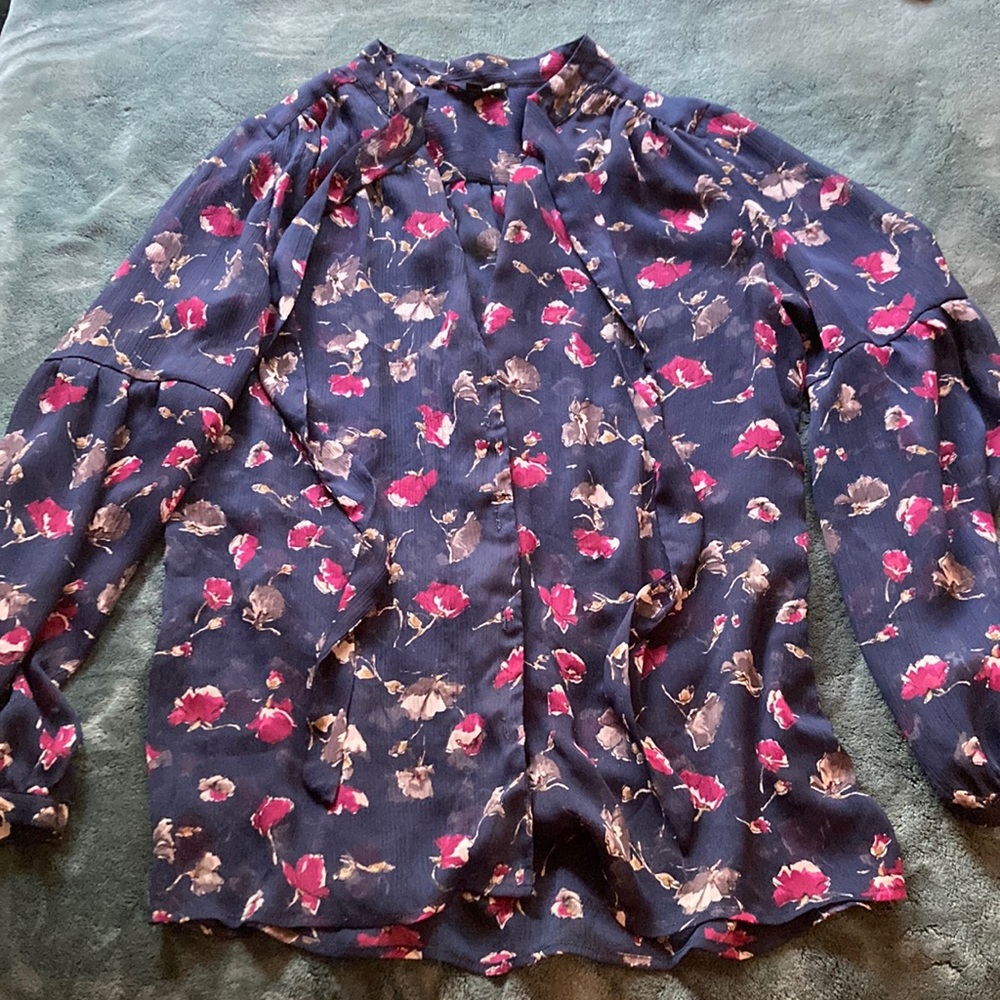 Womens button up blouse with tie.